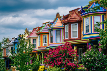 Fototapeta na wymiar Colorful row houses on Guilford Avenue, in Baltimore, Maryland