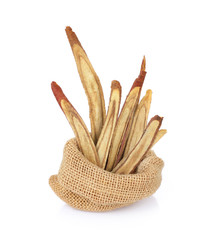 dried Liquorice roots on a white background.