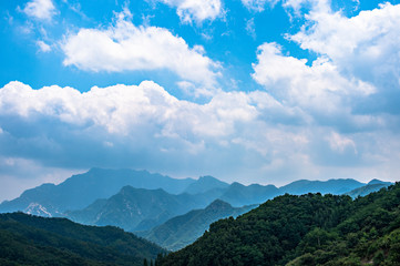Far view of Mount Tai in summer time, with its peak was surrounded by cloud 