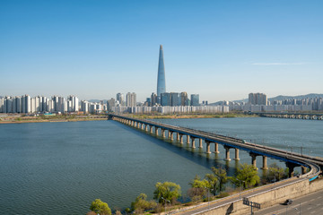 Cityscape of Seoul downtown business city skyline, Aerial view of Seoul city at Han river bridge with blue sky in Seoul city, South Korea