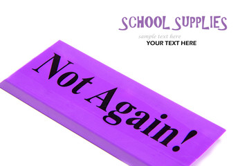 Close up of large purple eraser with message not again on a white background with text space
