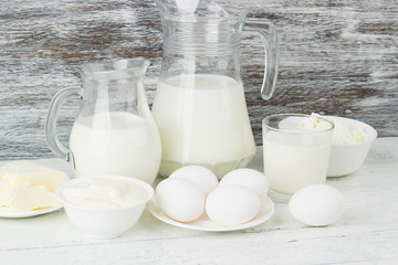Different dairy products on the wooden background