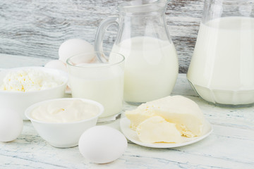 Different dairy products on the wooden background