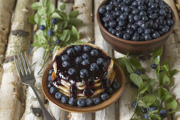 Pancakes with blueberry jam and blueberries