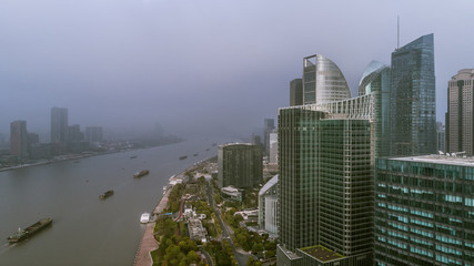 Naklejka premium aerial view of Shanghai Landmark Building in fog