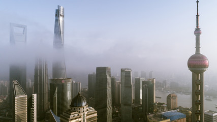 Skyscrapers above the dramatic clouds in Shanghai