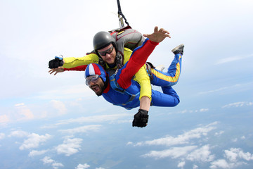 Tandem skydiving. Indian man is in the sky.