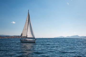 Fototapeta na wymiar Luxury yachts in the regatta. Racing on a boats of the Sea.