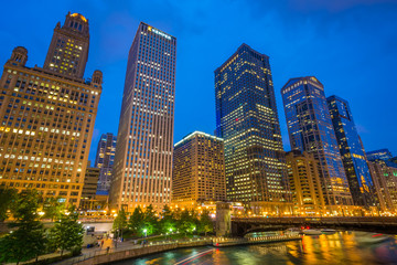 Skyscrapers along the Chicago River at night in Chicago, Illinois