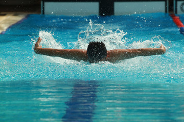 Young Man Swim Butterfly