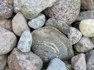 A lot of gray stones (cobblestones) of different shades together, an interesting background