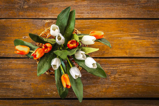 Bouquet of decorative artificial flowers on the floor.