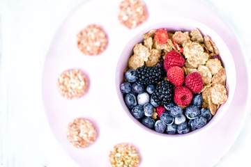 A healthy Breakfast of flakes and berries .biscuits from flakes