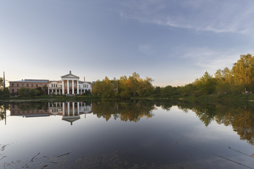 Moscow, Russia. Reflections of main building and trees in the pond. The Main Botanical Garden named after N.V. Tsitsin of Russian Academy of Sciences