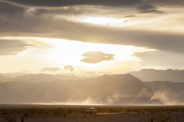 Vehicle Driving Under Dramatic Sky