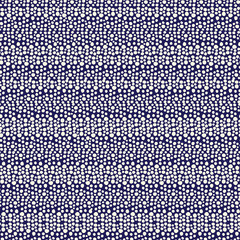 Abstract doodle dots seamless vector pattern. Irregular dots. White circles on dark blue background. Snowflakes pattern. Hand drawn doodle circles. Great for backgrounds, paper projects, packging.