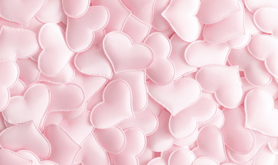 Obraz premium Valentines day background with hearts pink silk, copy space. Valentine day concept for design. Flat lay, top view, copy space 