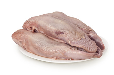 raw pork tongue isolated on white background