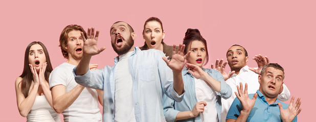 Group of frightened people, woman and man stressful keeping hands on head, terrified in panic,...