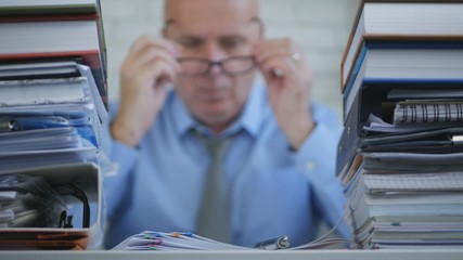 Obraz premium Businessman In Accounting Archive Working With Financial Documents