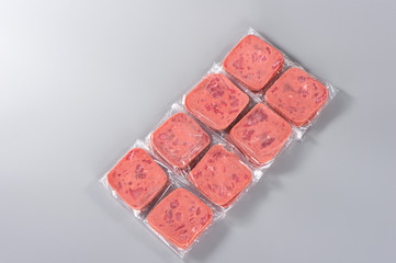 Sliced smoked ham isolated on gray background