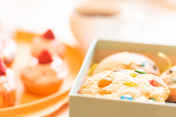 Cupcakes with whipped cream and cookies top view
