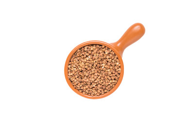 Buckwheat in a bowl. Overhead close up view, isolated on white background.