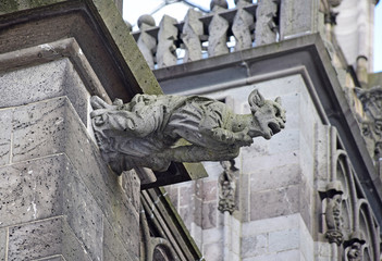 Gargoyle in the form of a devil on the outer wall of the Cologne Cathedral. Cologne, Germany,...