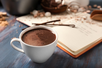 Cup of hot chocolate on wooden table