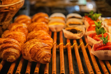 Tasty bakery with pastries on shelf in shop