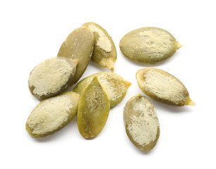 Obraz premium Pumpkin seeds for healthy nutrition and diet, organic superfood and plant based protein source, raw pepitas isolated on a clean white background