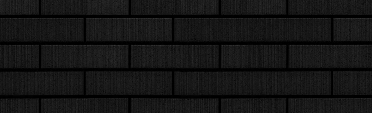 Panorama of black stone brick wall pattern and background seamless