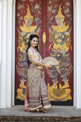 Fototapeta na wymiar Beautyful Thai woman wearing thai traditional clothing