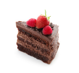 Piece of tasty chocolate cake with berries on white background