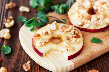 Healthy snacks sliced apples with honey and nuts