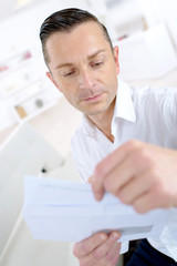 man reading a letter