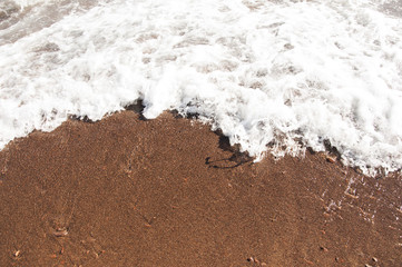 Wave on the beach background texture