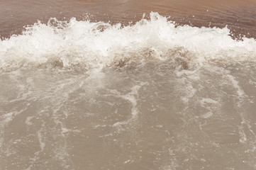 Wave on the beach background texture
