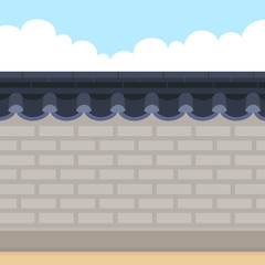 Traditional Korean style stone wall fence with sky background