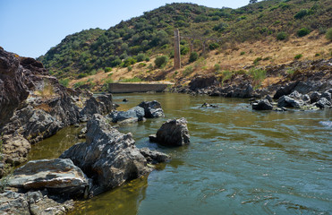 River Guadiana at the Pulo do Lobo waterfall and the remnants of old aqueduck. Alentejo, Portugal