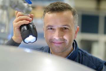 man with a flashlight in hand