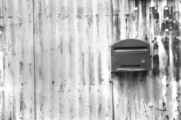 black and white ,mailbox with zince tiles wall, letter box with zince tiles wall