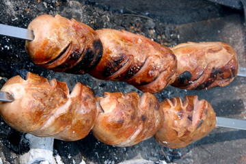 Cooking meat fresh meat barbecue on open wood coal fire