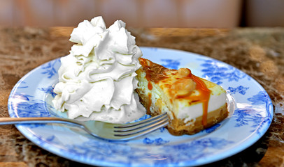 Cheesecake with caramel and cream