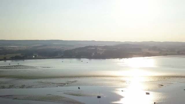 Lympstone harbour, right aerial pan. Sunset, sunrise. England.