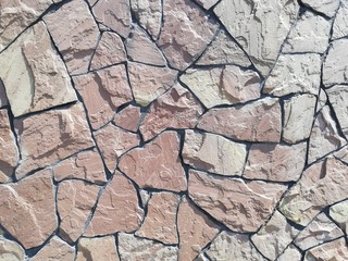 Texture of a stone wall. Old castle stone wall texture background. Stone wall as a background or texture. Part of a stone wall, for background or texture