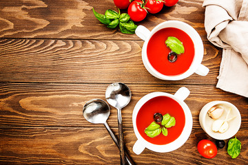 Tomato soup on wooden table