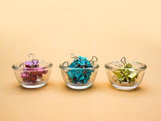 colorful binder clips : office supply on background