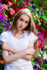 Portrait of a young girl in a circle of flowers.