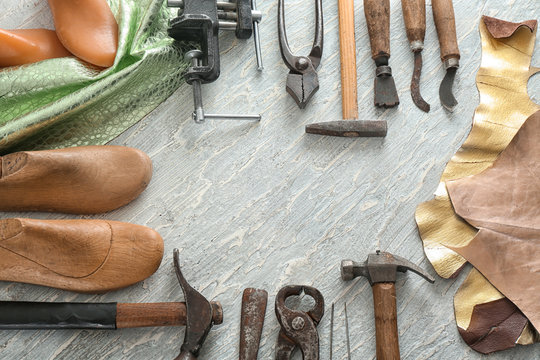 Composition with craft items on table in leather workshop
